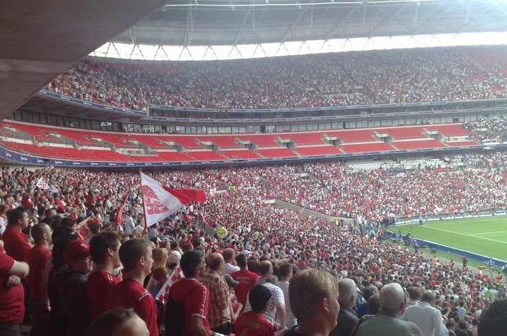 Football fans fill a stadium